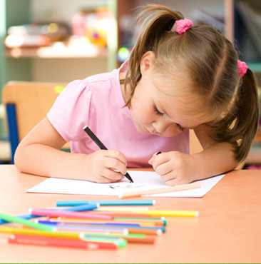 A little girl is writing on paper with markers.