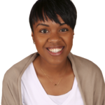 A woman with short hair smiles for the camera.